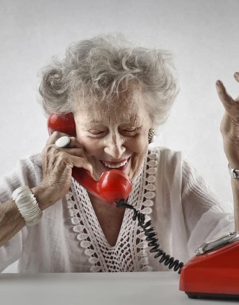 Chatty elderly woman doing a phone call