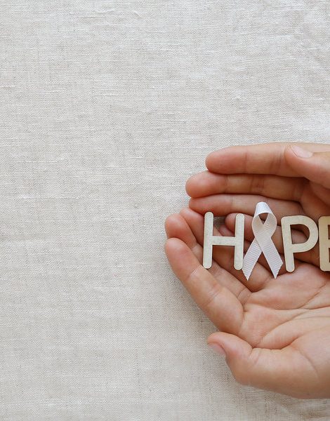 HOPE and white ribbon on hands Bone cancer awareness Multiple Hereditary Exostoses Postpartum Depression