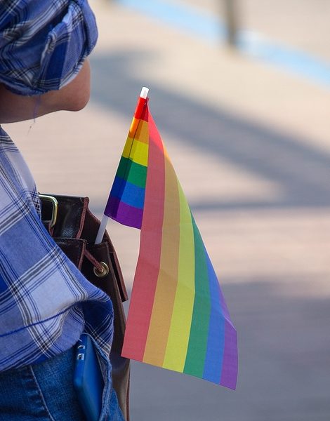Flag of the rainbow in the bag of the participant of the community lgbt. Symbols