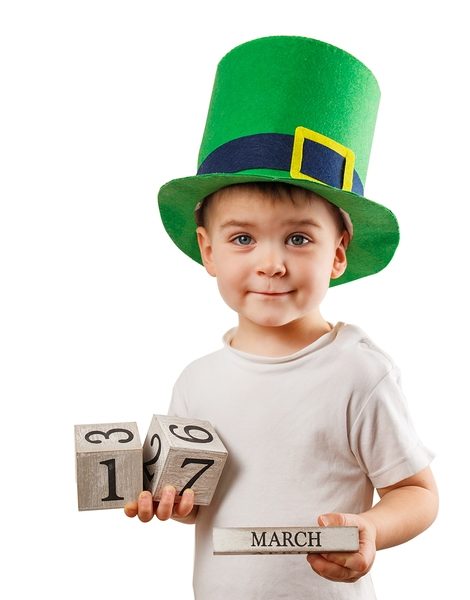 Little boy with Leprechaun hat on white background. St Patrick's Day.
